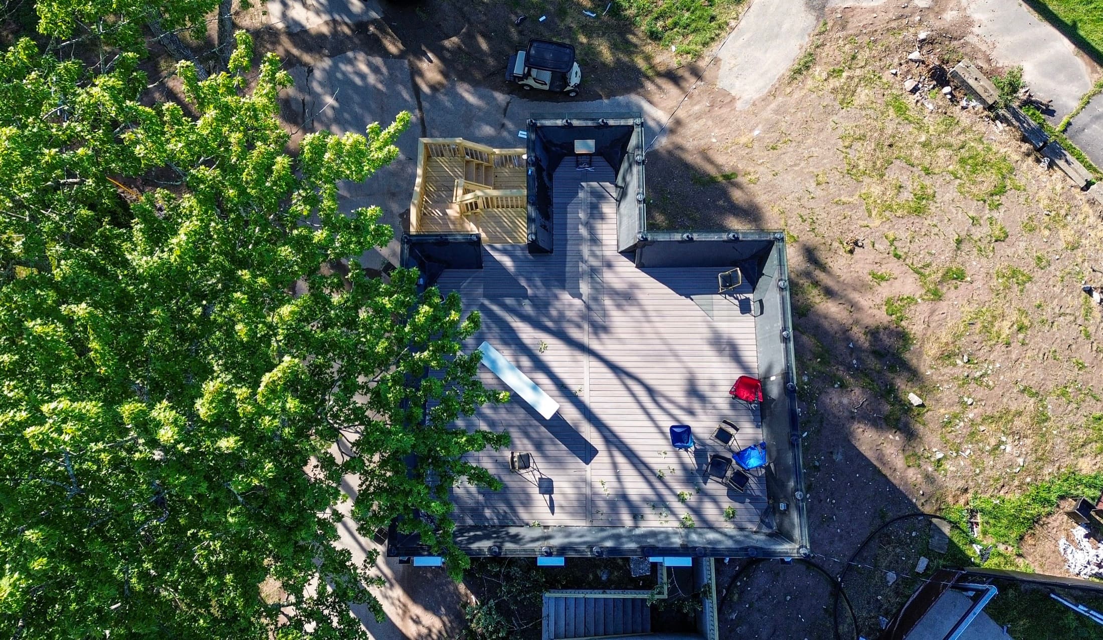 Directly overhead: a dormitory roof deck under construction with materials staged across it